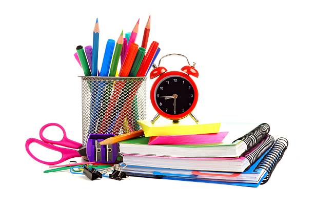 istock School supplies with alarm clock over white 482448704