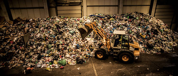 istock Panoramic shot of the excavator in the garbage dump 482451260