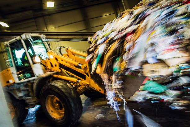 istock Blurred motion shot of the excavator in the garbage dump 482451290