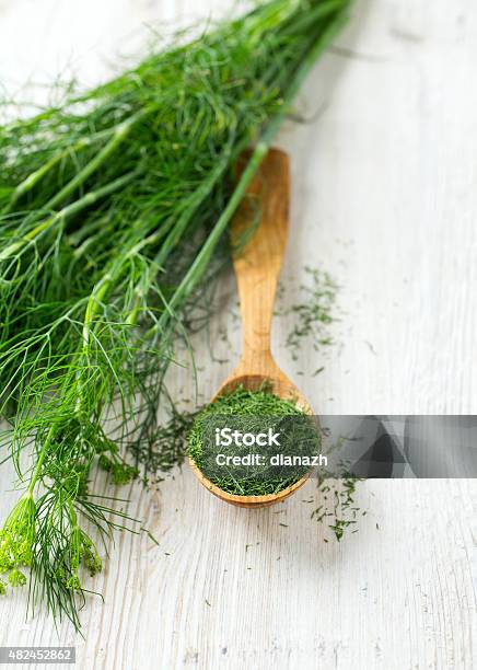 Dried Dill In A Wooden Spoon Stock Photo - Download Image Now - Dill, 2015, Cooking