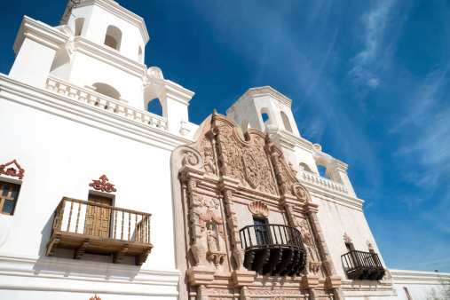 San Xavier del Bac Mission on the Tohono O'odham Indian Reservation near Tucson, Arizona are photographed on a warm spring day. Nicknamed the 