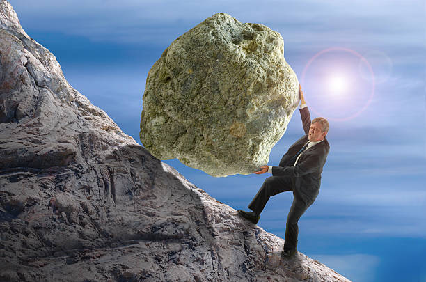 sisyphus метафоре человек прокатки огромной скалы мяч хилл - rock rolling pushing stone стоковые фото и изображения