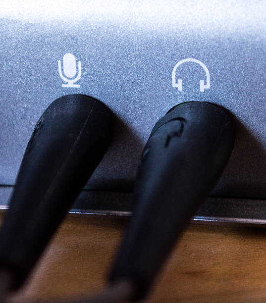 Headphone and microphone plug with some jacks plugged in.