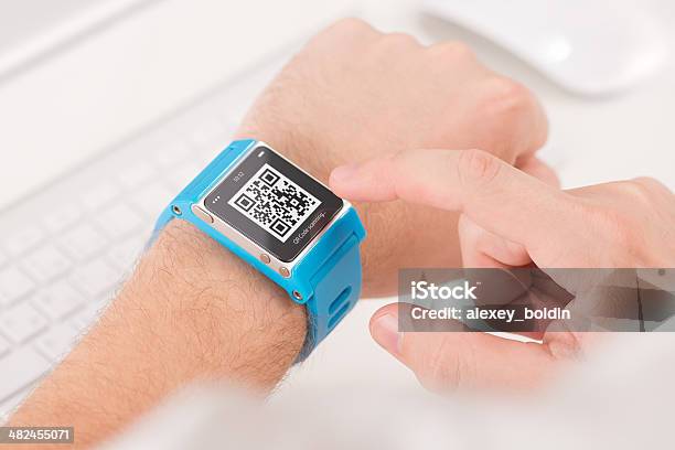 Scanning Quick Response Code With Smart Watch Stock Photo - Download Image Now - Bracelet, QR Code, Clock