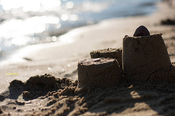 istock Sand castle on the beach at sunset 482456672
