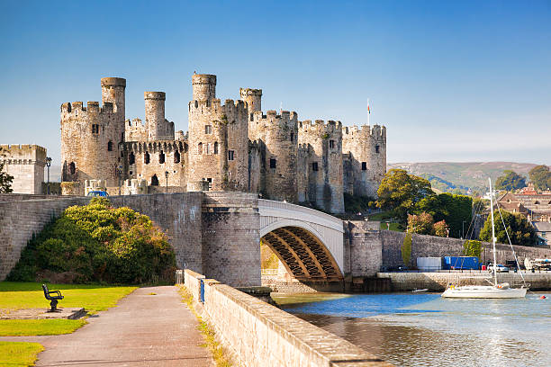 Conwy Castle in Wales, United Kingdom, series of Walesh castles Conwy, Wales , United Kingdom- September 10, 2014:  The Conwy castle with yacht castle photos stock pictures, royalty-free photos & images
