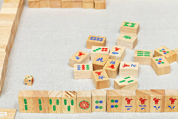 istock player hand from wooden tiles in mahjong game 482457501