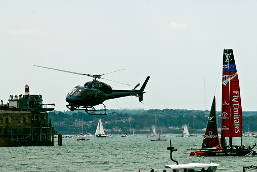 Portsmouth, UK, July 25th 2015. The camera helicopter filming the America’s Cup races in Portsmouth.