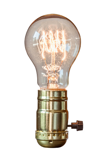Decorative retro edison style filament light bulb with white background.