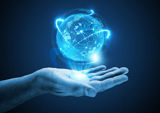Projecting The Future Projecting The Future. A hand holding a holographic projection. coming out of computer screen stock pictures, royalty-free photos & images