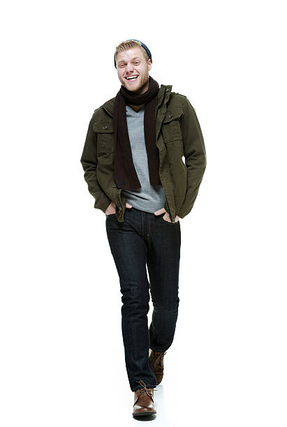 istock Cheerful man walking and wearing winter clothes 482461837