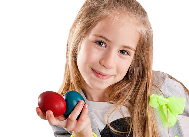 istock cute little girl with easter eggs 482461863