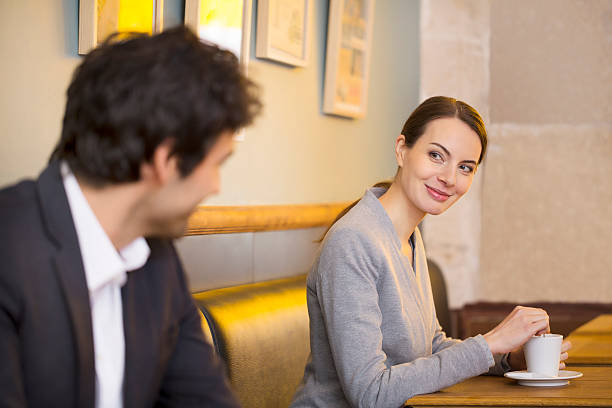Couple Flirting Together In Bar stock photo