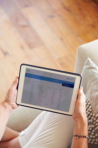 istock Woman Looking At Banking App On Digital Tablet 482463320