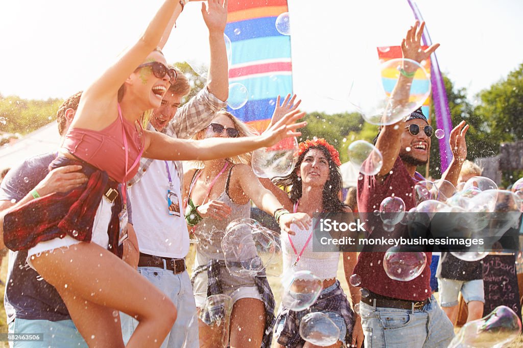 Friends enjoying a performance at a music festival 20-29 Years Stock Photo