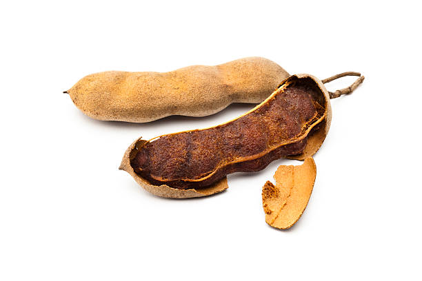 istock Two tamarind beans isolated on white background 482463548