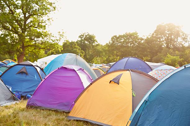 Tents at a music festival campsite Tents at a music festival campsite music festival camping summer vacations stock pictures, royalty-free photos & images