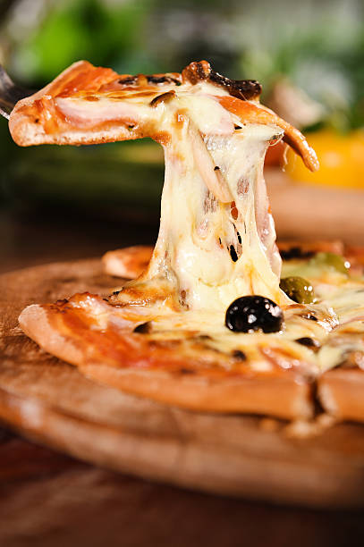 istock pizza on wooden background 482464246