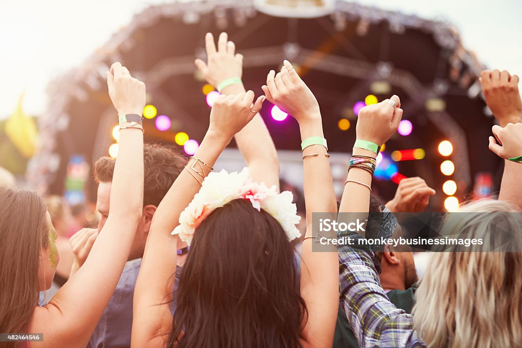 Audience with hands in the air at a music festival Music Festival Stock Photo