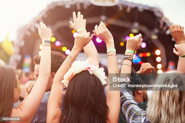Audience With Hands In The Air At A Music Festival Stock Photo - Download Image Now - Music Festival, Outdoors, Summer