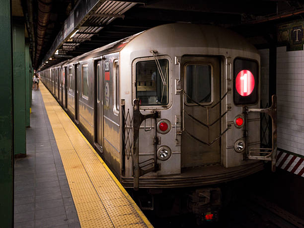 NYC Subway New York, USA - July 7, 2015: The #1 train leaving the Times Square Subway Platform late in the night headed to Lower Manhattan. 42nd street photos stock pictures, royalty-free photos & images