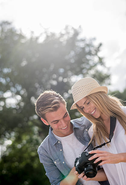 istock Couple taking pictures outdoors 482465456