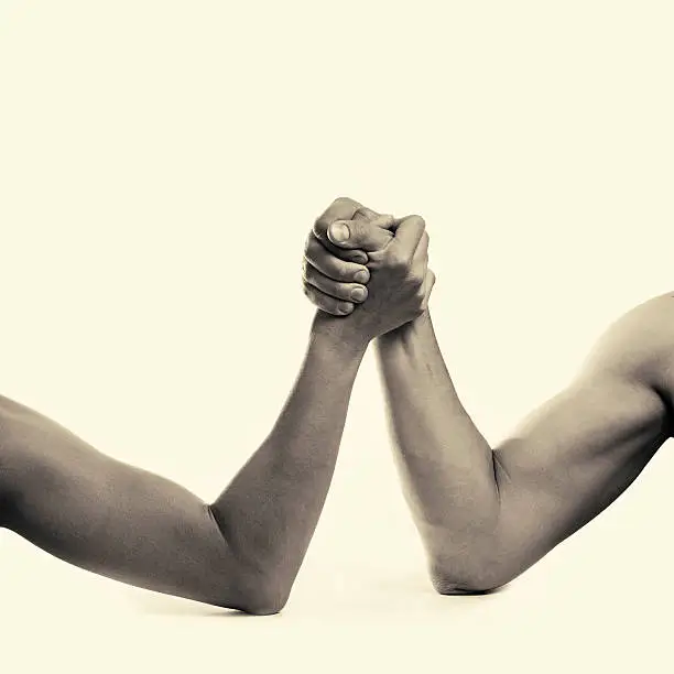 two hands depicting the rivalry of men and women