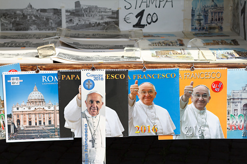 Rome, Italy - April 14, 2015: Pope Francis calendars for sale at an outdoor booth in Rome, Italy.