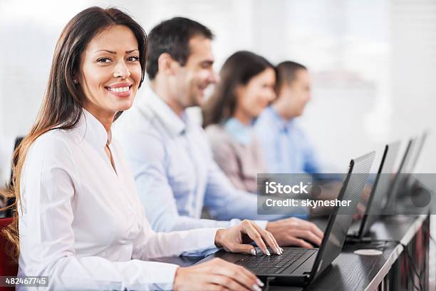 Business People At A Computer Class Stock Photo - Download Image Now - Computer Lab, Corporate Business, 30-39 Years