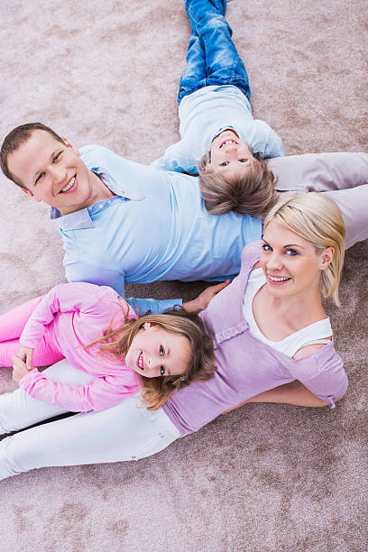 istock Young family lying on carpet. 482468011