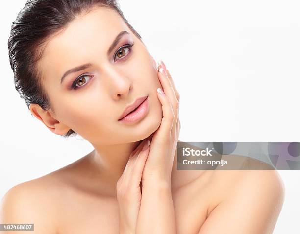 Beautiful Girl Touching Her Face Stock Photo - Download Image Now - Beautiful Woman, Facial Mask - Beauty Product, Women
