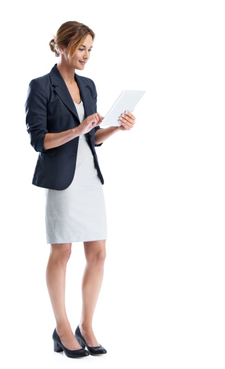 Full length shot of a smiling businesswoman using a digital tablet while isolated on white