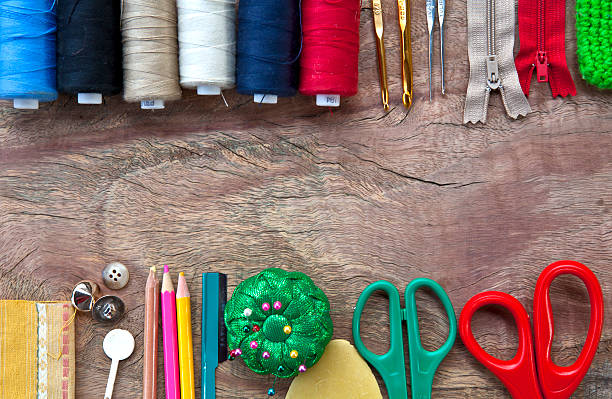 istock space for message with threads and needles works wood background 482477693