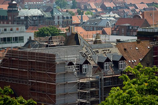 New roof on house in Fredericia City, Denmark, Scandinavia. High up view a beautiful hot summer day.