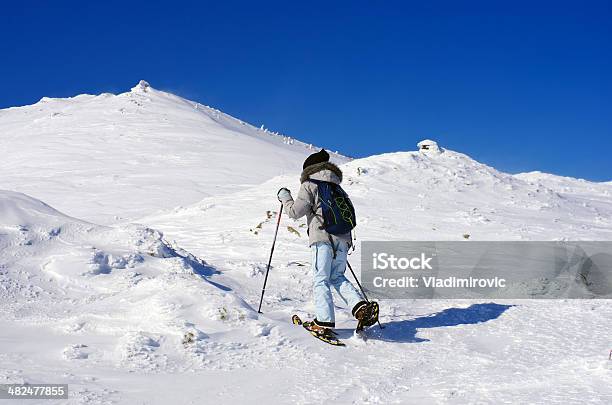 Girl Uphill Winter Snow Stock Photo - Download Image Now - Active Lifestyle, Activity, Adult