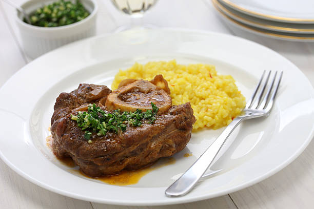 ossobuco alla milanese, Italian cuisine Ossobuco is a Milanese specialty of cross cut veal shanks braised with vegetables ossobuco stock pictures, royalty-free photos & images
