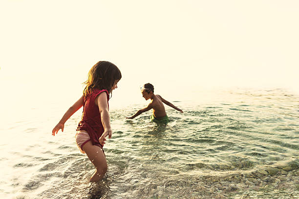 istock Kids playing in the water. 482480192