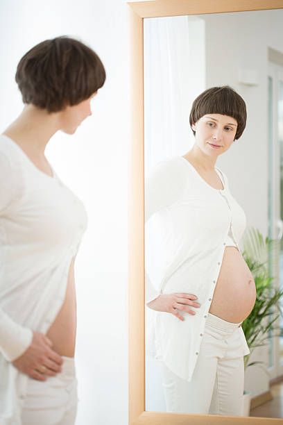 istock Woman before and during pregnancy 482480474