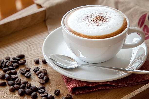 istock Cup of cappuccino and coffee beans 482481310