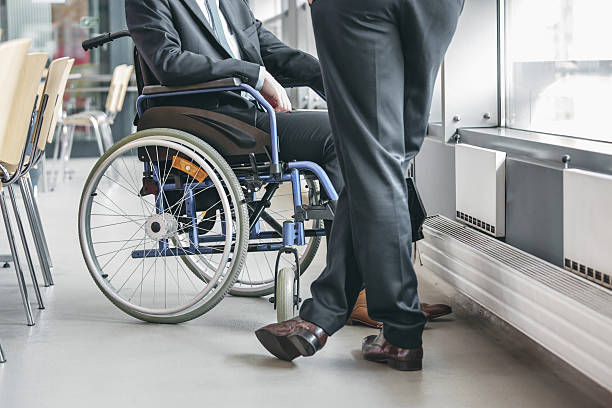 istock Disabled businessman working in an office 482483736