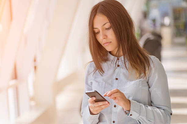 istock Young woman with smartphone. 482483872