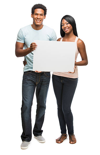 istock Young enthusiast couple holding a white sign 482484303
