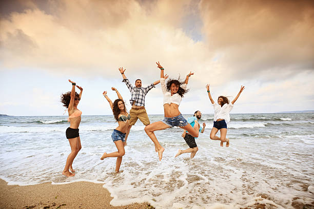istock Below view of young people having fun in the sea 482484864