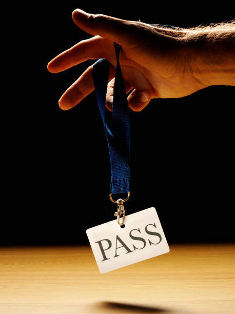 istock Holding a Security Pass Badge with the Word Pass 482487349