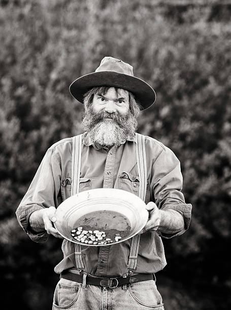 istock Old-fashioned Western prospector showing his pan black and white 482487745