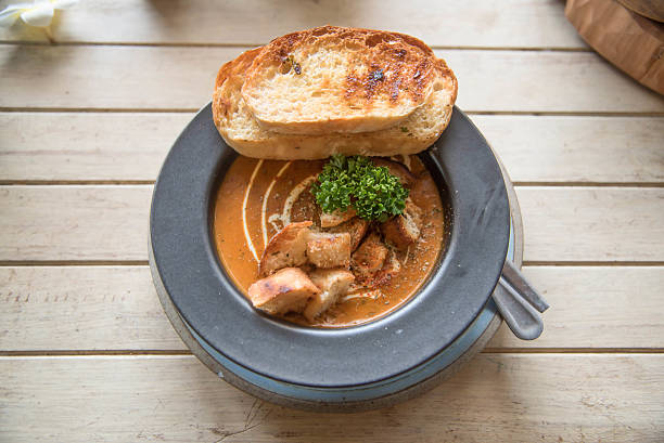 istock tomato soup in a black bowl whit toast bread 482488942