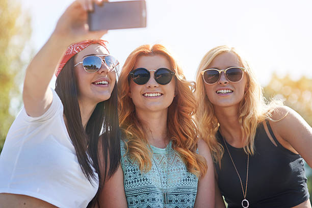 istock Three best friends taking a selfie outdoors 482488998