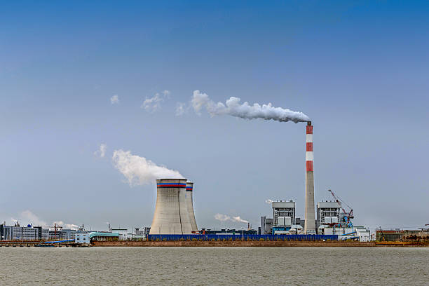 istock power station at riverbank 482490448