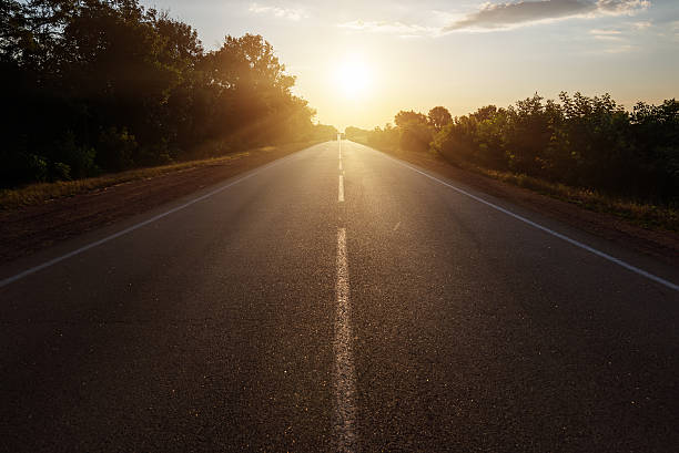 istock asphalt road to horizon in sunset 482490564