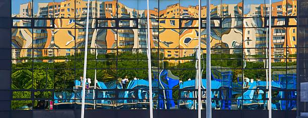 Architecture, abstract, reflection residential blocks in the glass facade